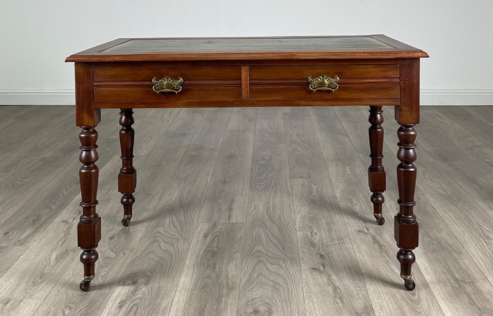 Antique 20th Century Leather Top Writing Table In Mahogany