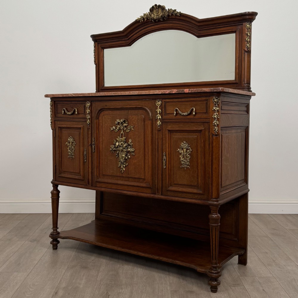A pair of 19th-century French dark wood cabinets featuring pink marble tops, mirrored upper backs, gilded metal mounts, and lower open shelves. View IV