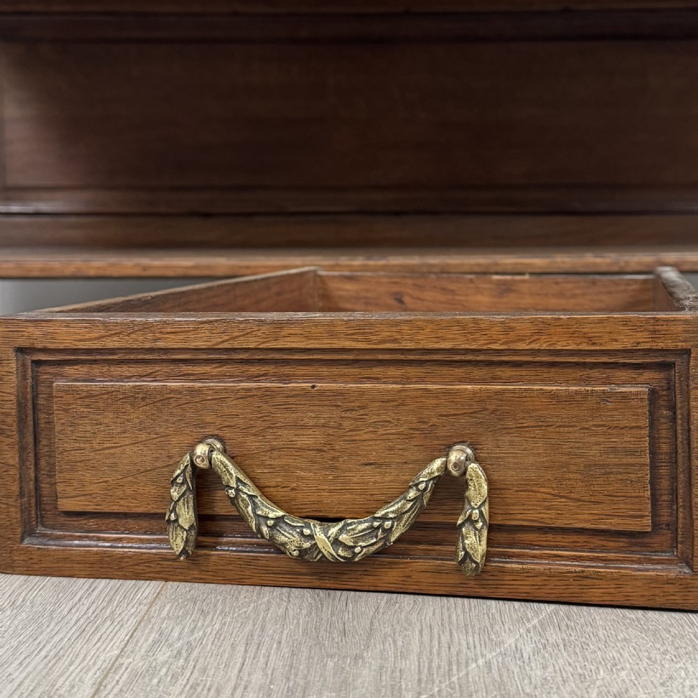 A pair of 19th-century French dark wood cabinets featuring pink marble tops, mirrored upper backs, gilded metal mounts, and lower open shelves. View XIV