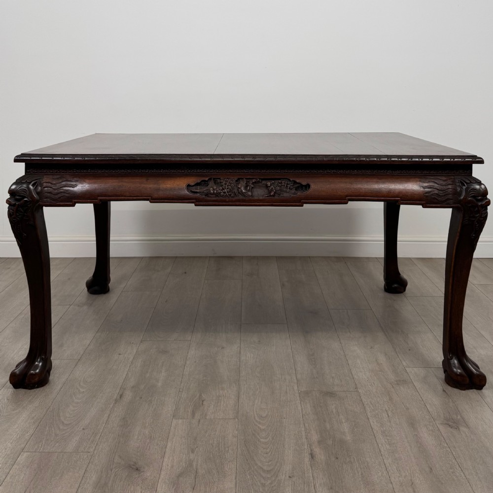 A dark carved rosewood dining suite featuring a rectangular table with carved cabriole legs accompanied by six splat-back chairs including two armchairs. View III