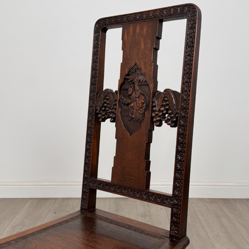 A dark carved rosewood dining suite featuring a rectangular table with carved cabriole legs accompanied by six splat-back chairs including two armchairs. View XIII