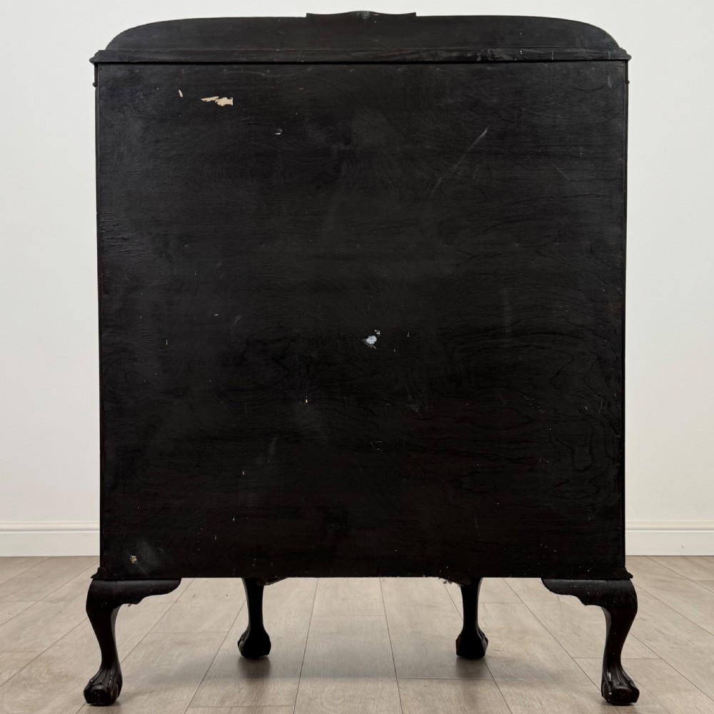 An early twentieth-century mahogany bow-front display cabinet featuring curved glass doors, vertical glazing bars, internal shelves, and cabriole legs with ball-and-claw feet. View VI