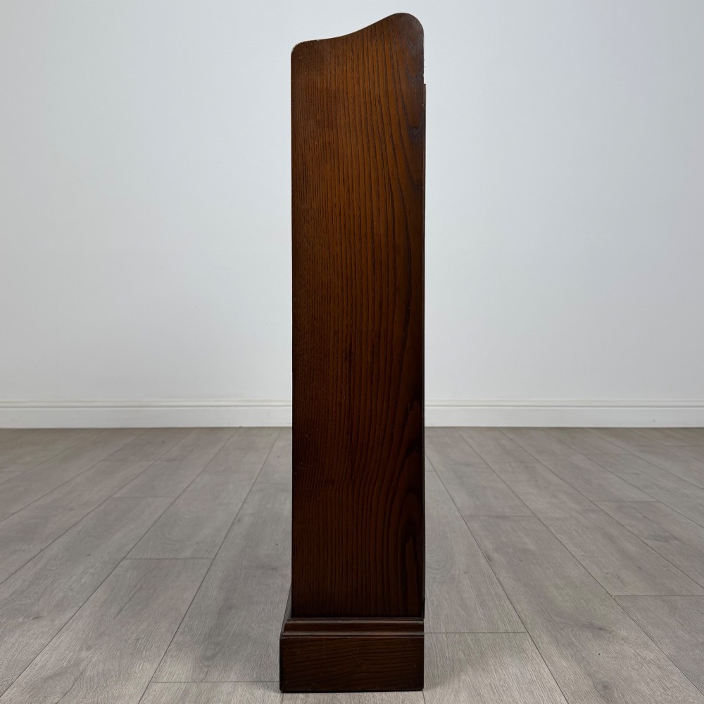 A twentieth-century dark oak open bookcase with three fitted shelves and profiled side edges. View IV