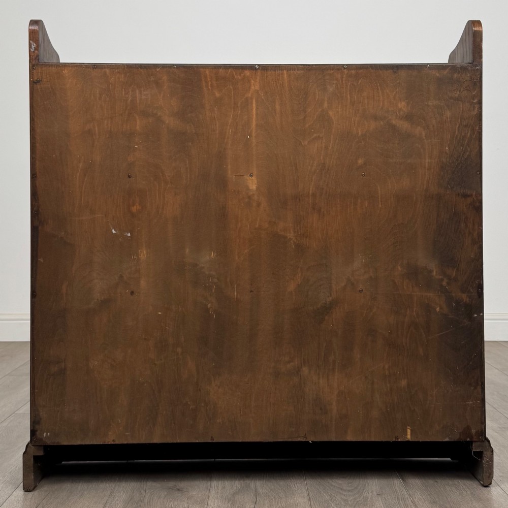 A twentieth-century dark oak open bookcase with three fitted shelves and profiled side edges. View VI