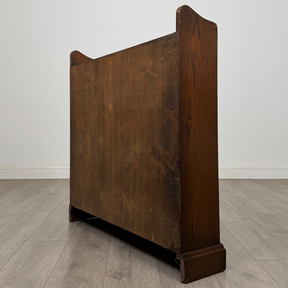 A twentieth-century dark oak open bookcase with three fitted shelves and profiled side edges. View VII