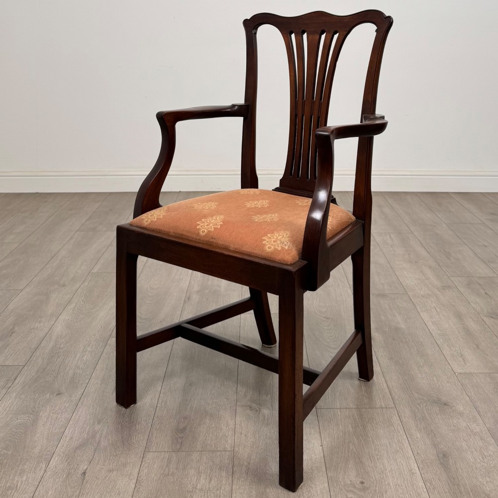 A set of eight 19th-century Georgian style mahogany dining chairs featuring carved pierced splat backs and patterned terracotta upholstery. View II