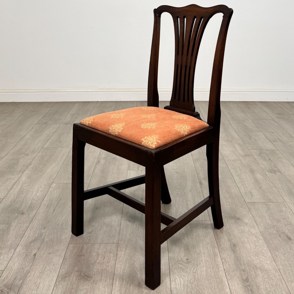 A set of eight 19th-century Georgian style mahogany dining chairs featuring carved pierced splat backs and patterned terracotta upholstery. View III