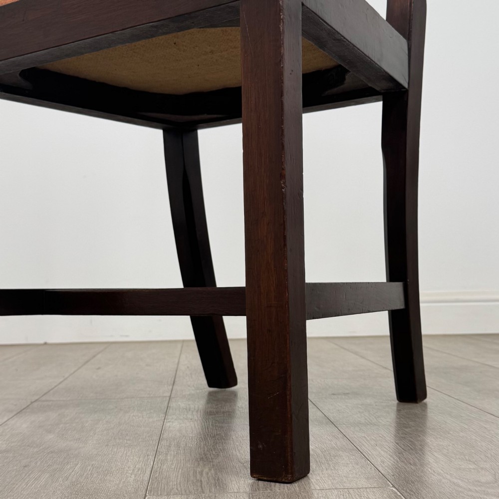 A set of eight 19th-century Georgian style mahogany dining chairs featuring carved pierced splat backs and patterned terracotta upholstery. View VII
