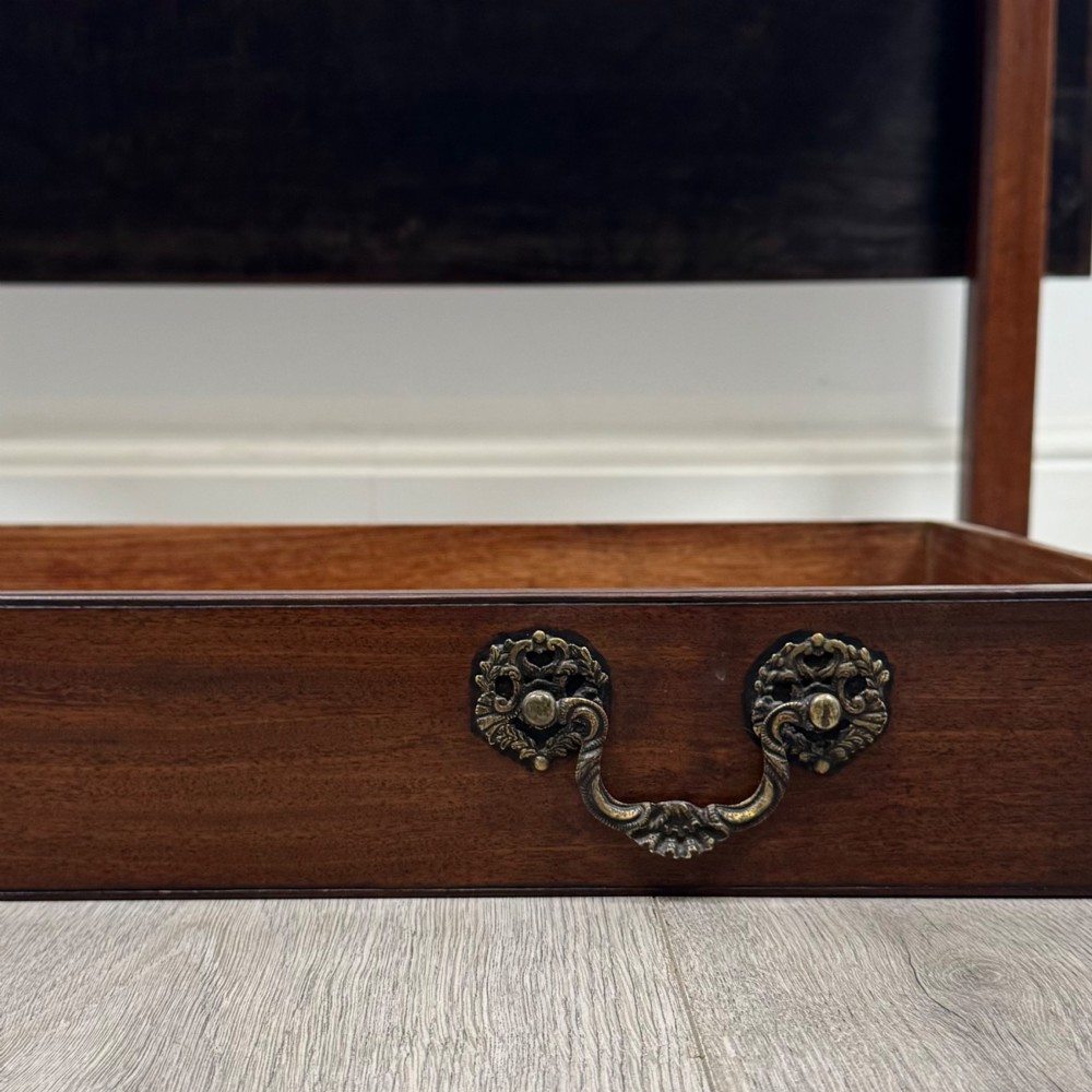 An 18th-century Georgian mahogany writing table featuring a rectangular top, a single wide frieze drawer with brass handles and central escutcheon, supported by straight square legs. View XIII