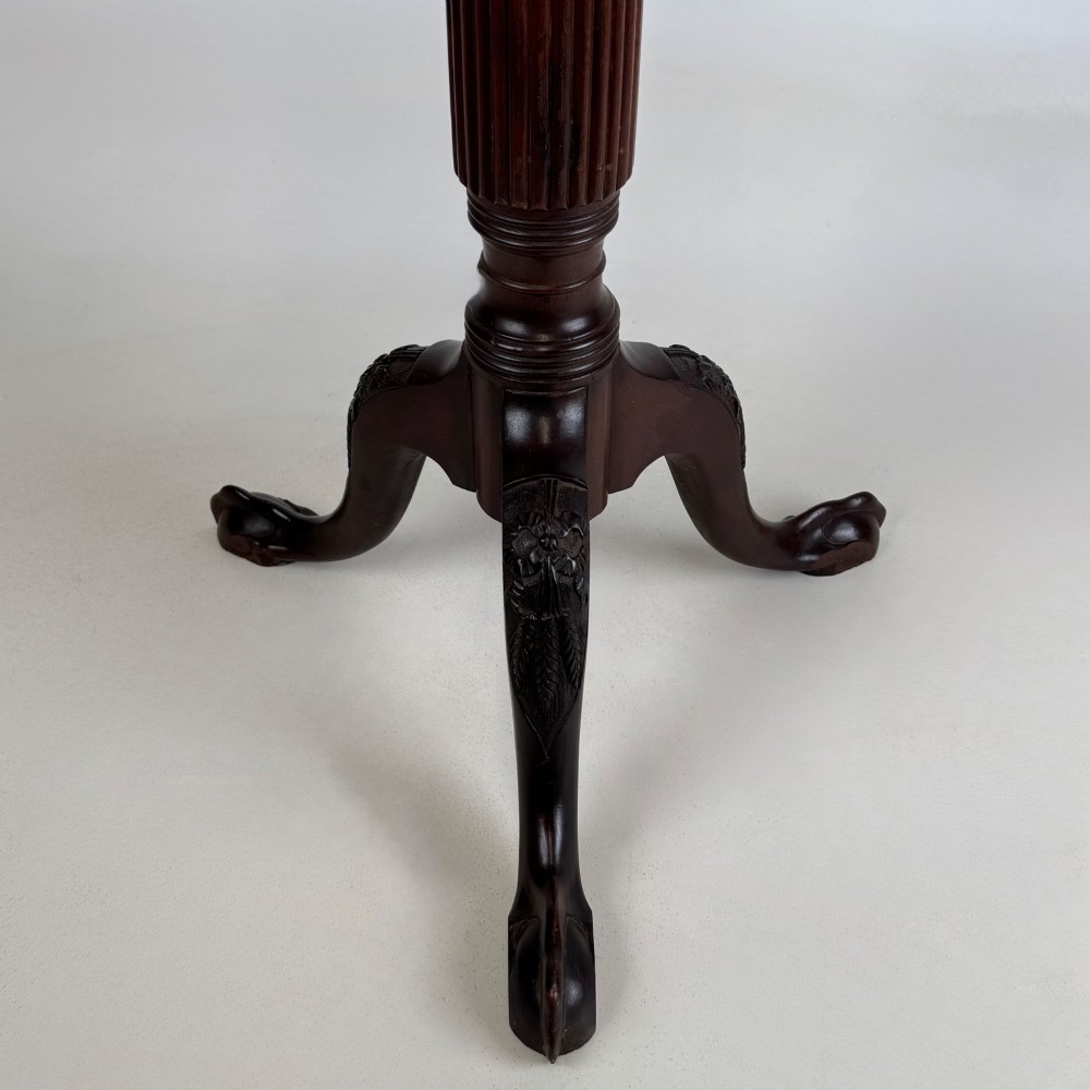 A tall Victorian dark mahogany plant stand featuring a carved fluted column, acanthus leaf details, and a tripod base. View IV