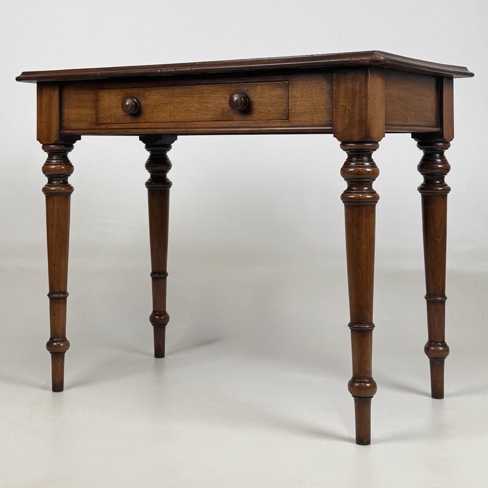 A 19th-century Victorian mahogany side table featuring a single drawer with two turned wooden handles and four turned legs. View II