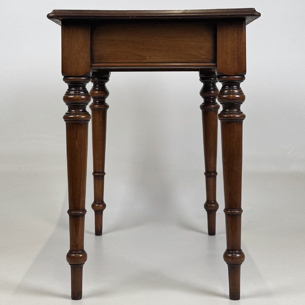 A 19th-century Victorian mahogany side table featuring a single drawer with two turned wooden handles and four turned legs. View III