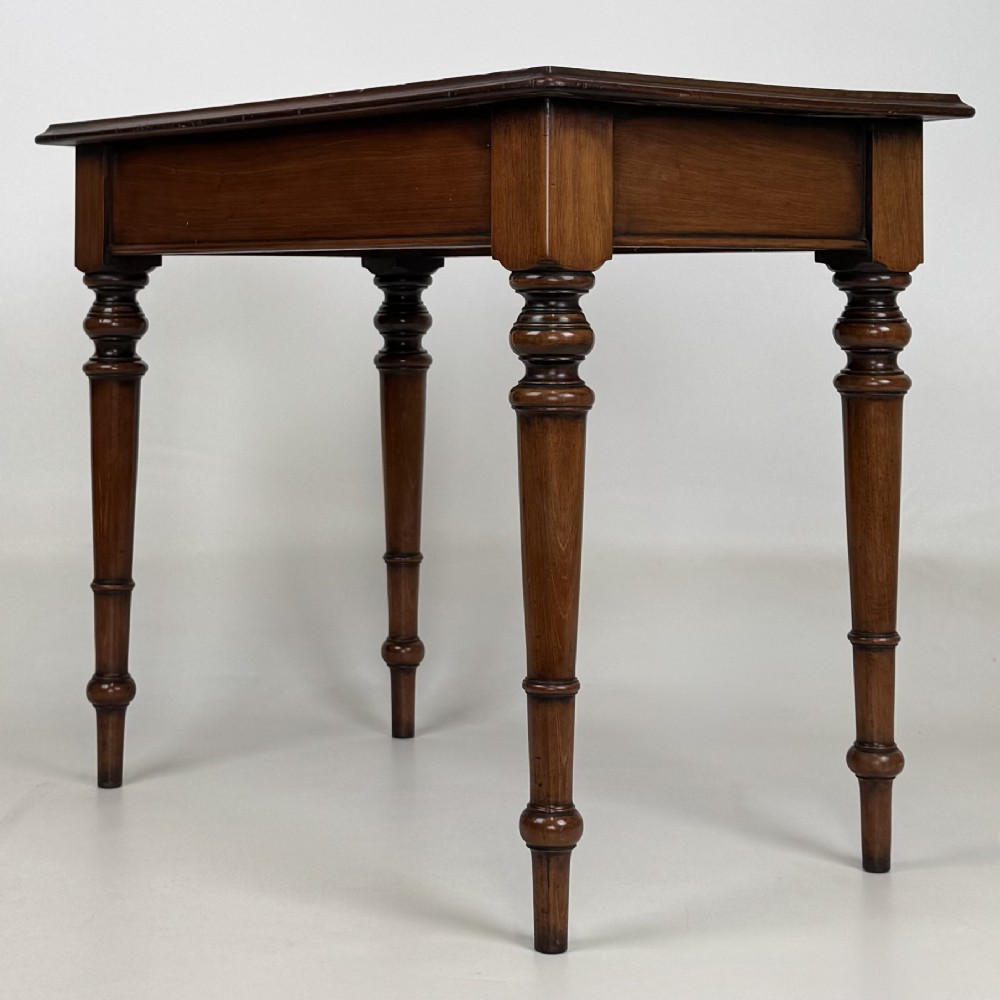 A 19th-century Victorian mahogany side table featuring a single drawer with two turned wooden handles and four turned legs. View VI