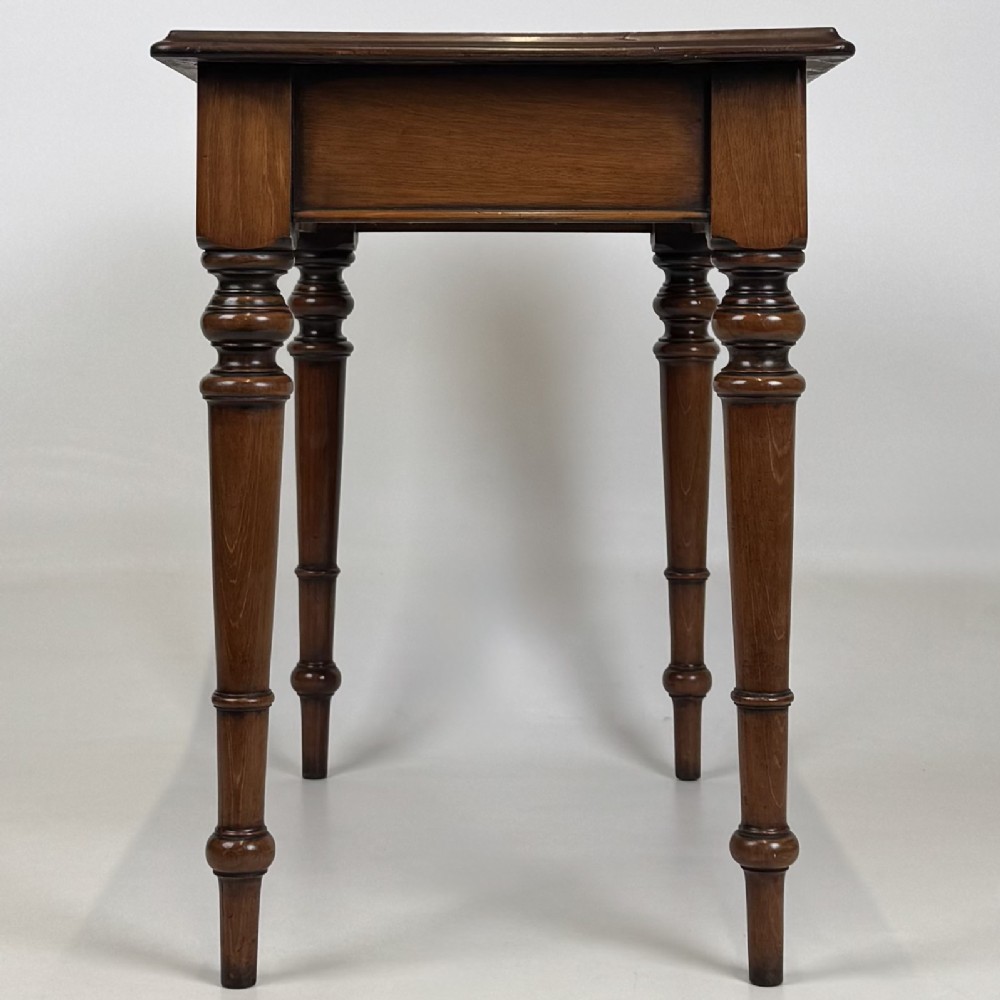 A 19th-century Victorian mahogany side table featuring a single drawer with two turned wooden handles and four turned legs. View VII
