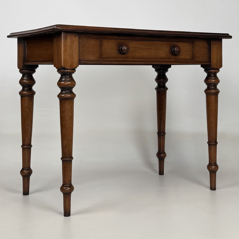 A 19th-century Victorian mahogany side table featuring a single drawer with two turned wooden handles and four turned legs. View VIII