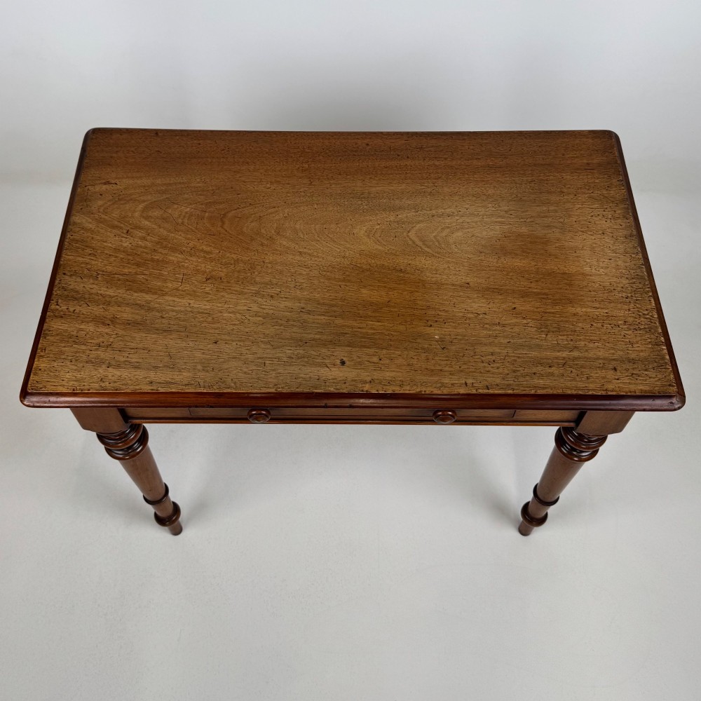 A 19th-century Victorian mahogany side table featuring a single drawer with two turned wooden handles and four turned legs. View IX