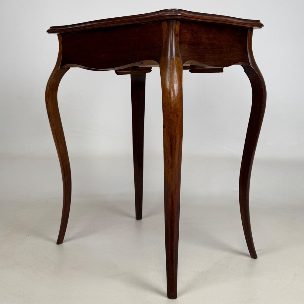 A 19th-century French mahogany side table featuring high cabriole legs, a single frieze drawer with a brass keyhole, and a shaped apron. View VI