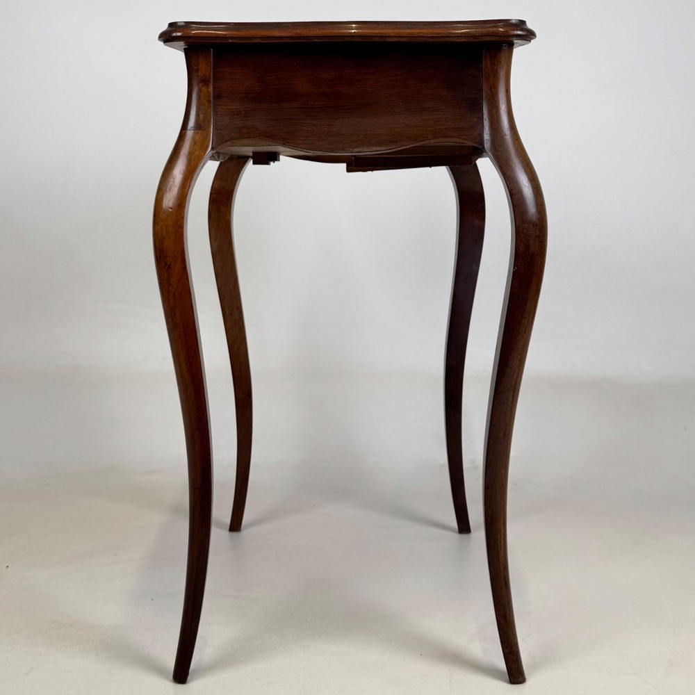 A 19th-century French mahogany side table featuring high cabriole legs, a single frieze drawer with a brass keyhole, and a shaped apron. View VII