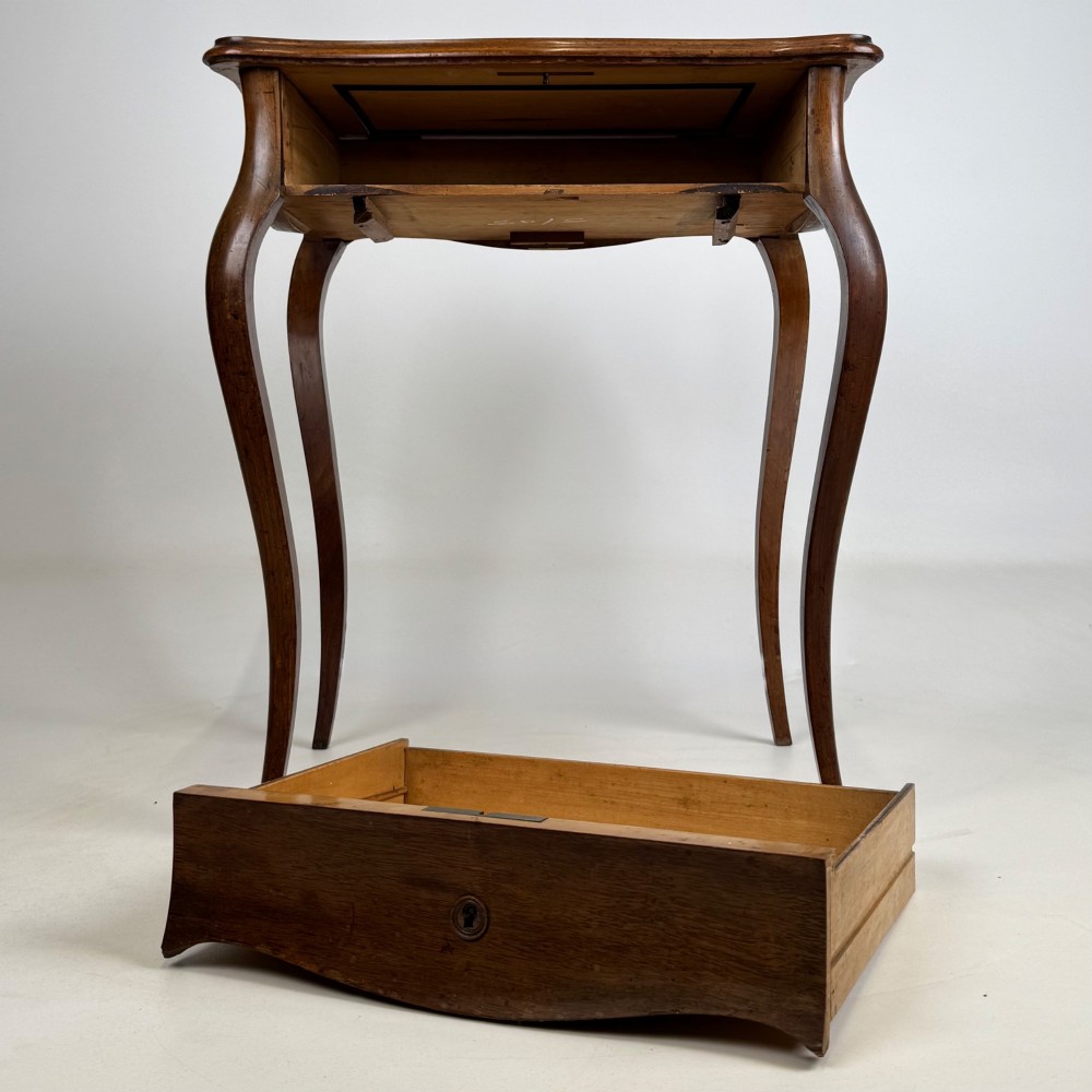 A 19th-century French mahogany side table featuring high cabriole legs, a single frieze drawer with a brass keyhole, and a shaped apron. View IX