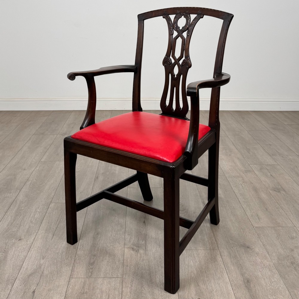 A set of six dark mahogany Georgian dining chairs featuring pierced back splats, straight legs with stretchers, and bright red leather drop-in seats. View II