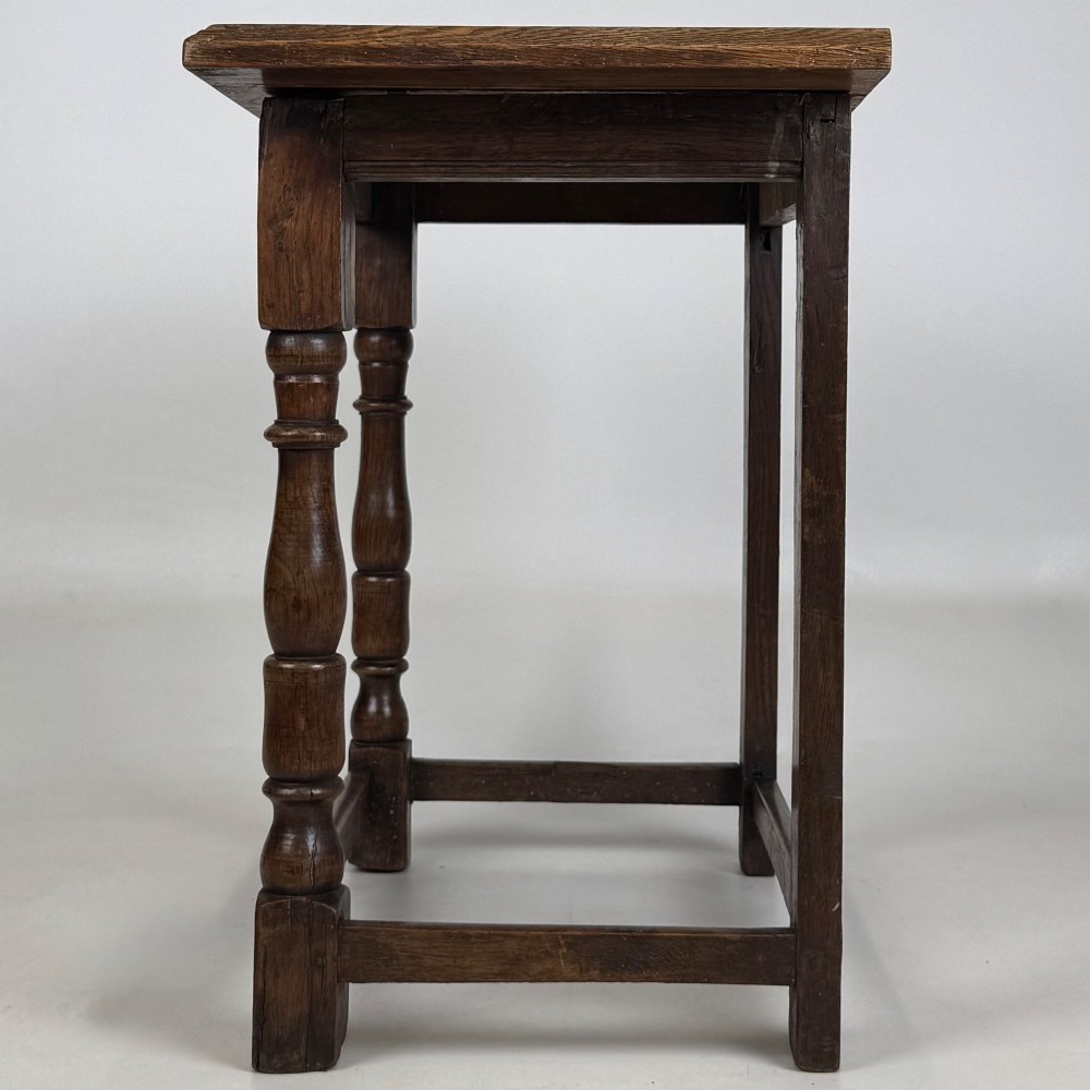 A 19th-century dark oak side table featuring a rectangular flat top, turned baluster legs, and sturdy lower stretchers. View III