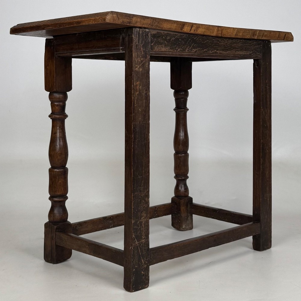 A 19th-century dark oak side table featuring a rectangular flat top, turned baluster legs, and sturdy lower stretchers. View IV