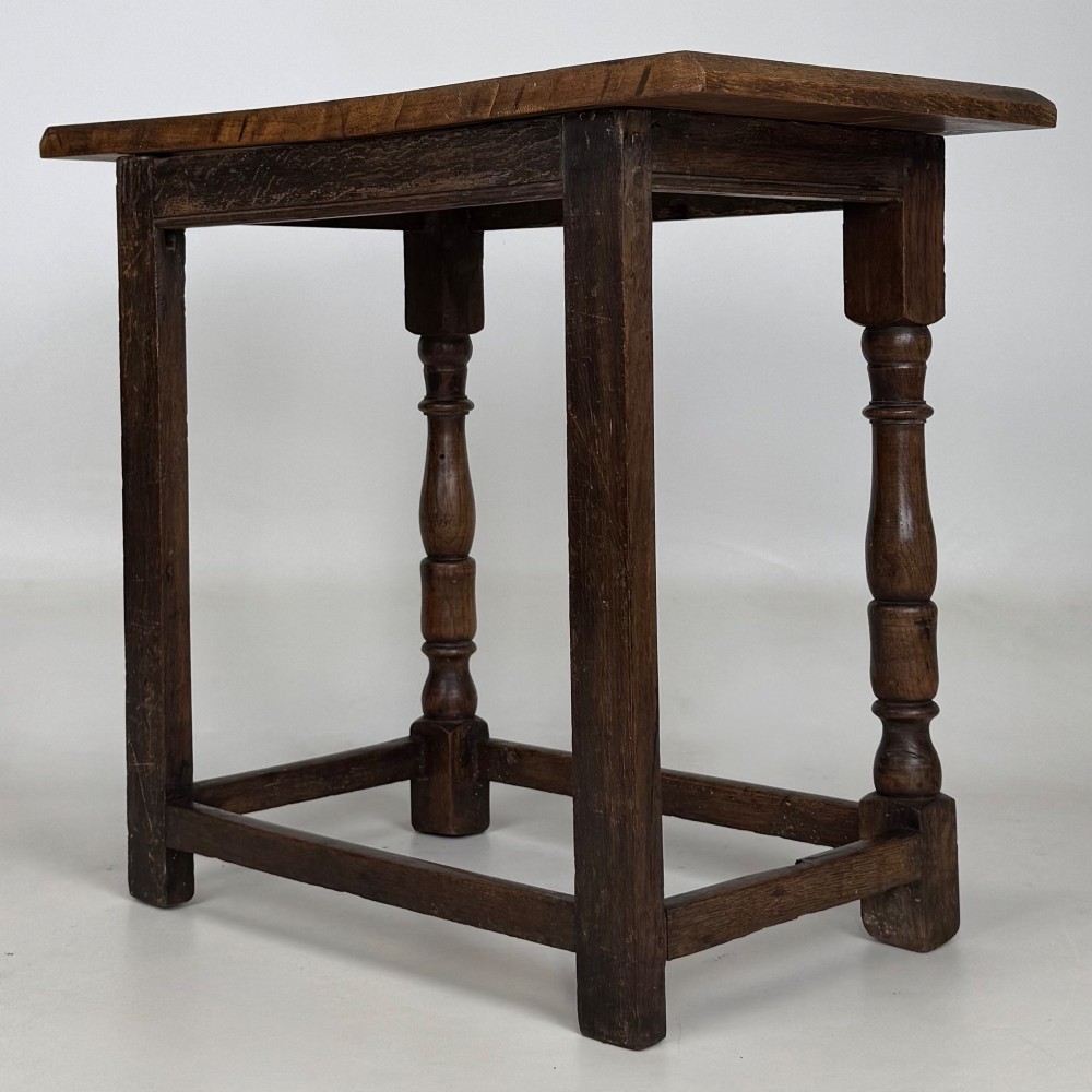 A 19th-century dark oak side table featuring a rectangular flat top, turned baluster legs, and sturdy lower stretchers. View VI