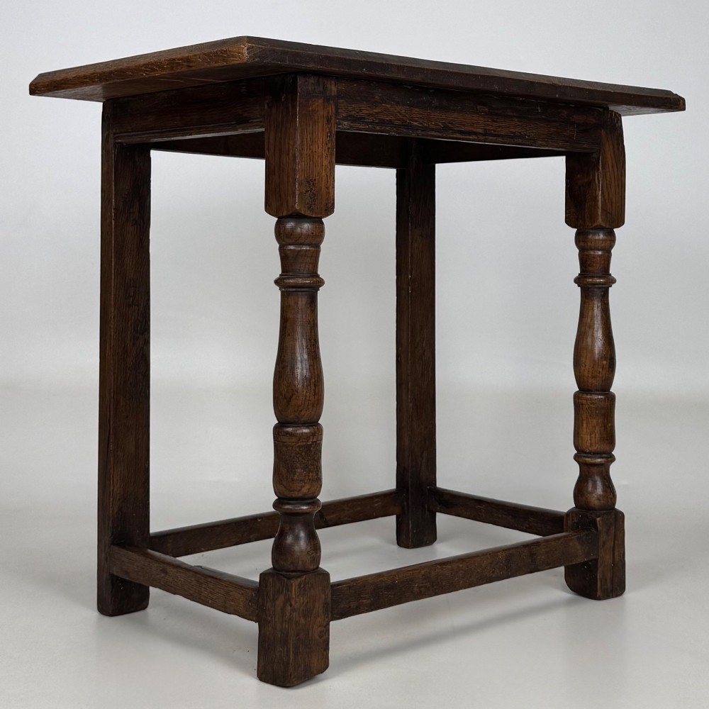 A 19th-century dark oak side table featuring a rectangular flat top, turned baluster legs, and sturdy lower stretchers. View VIII