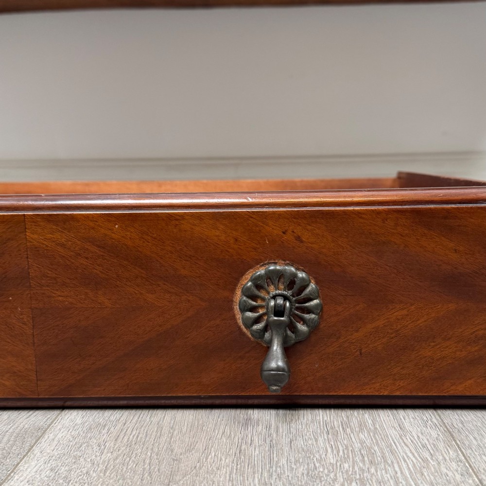 An Edwardian mahogany sideboard featuring two top drawers above a two-door cabinet supported on slender cabriole legs. View XII