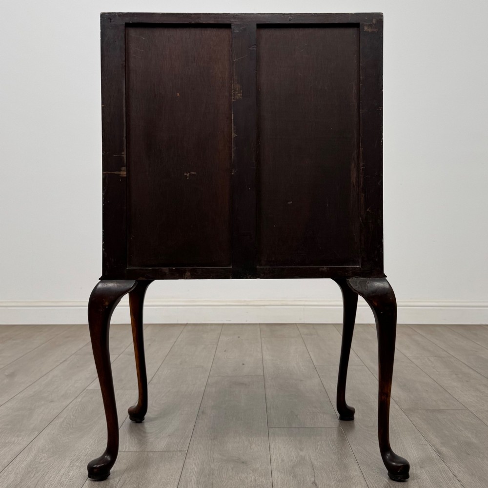 An Edwardian mahogany writing bureau featuring a sloped drop-front lid above two drawers, supported by four slender cabriole legs. View VI