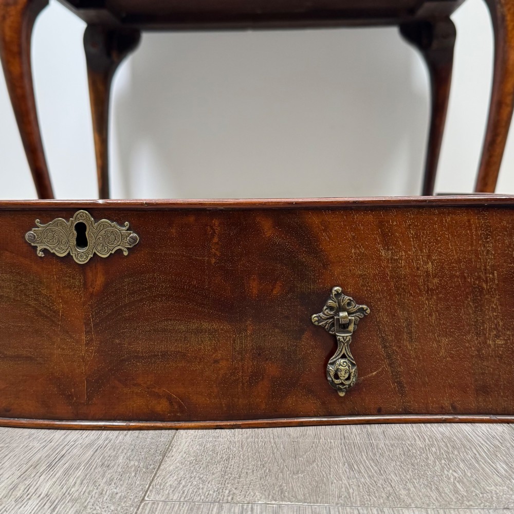 An Edwardian mahogany writing bureau featuring a sloped drop-front lid above two drawers, supported by four slender cabriole legs. View XIII