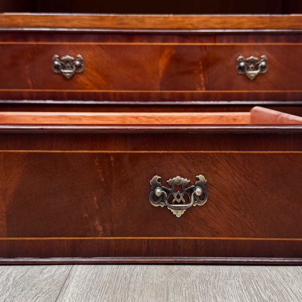 A 20th-century inlaid mahogany chest of drawers featuring two short over three long drawers with decorative brass handles. View XI