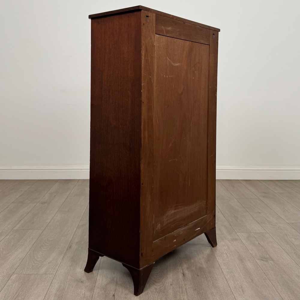 A tall 19th-century Regency mahogany open bookcase featuring four open shelves, a top drawer with twin brass knobs, and flared feet. View V