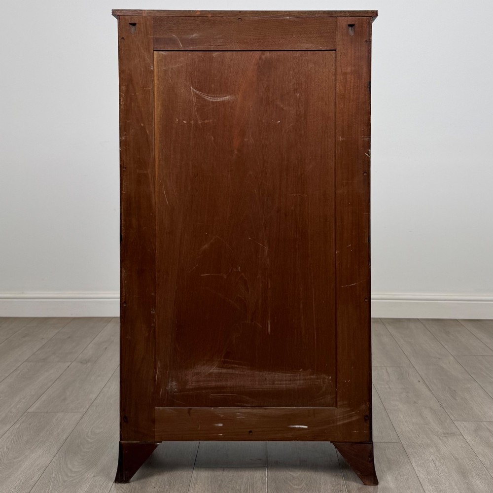 A tall 19th-century Regency mahogany open bookcase featuring four open shelves, a top drawer with twin brass knobs, and flared feet. View VI