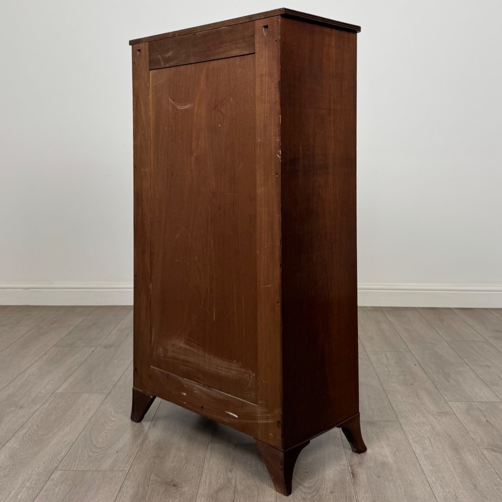 A tall 19th-century Regency mahogany open bookcase featuring four open shelves, a top drawer with twin brass knobs, and flared feet. View VII