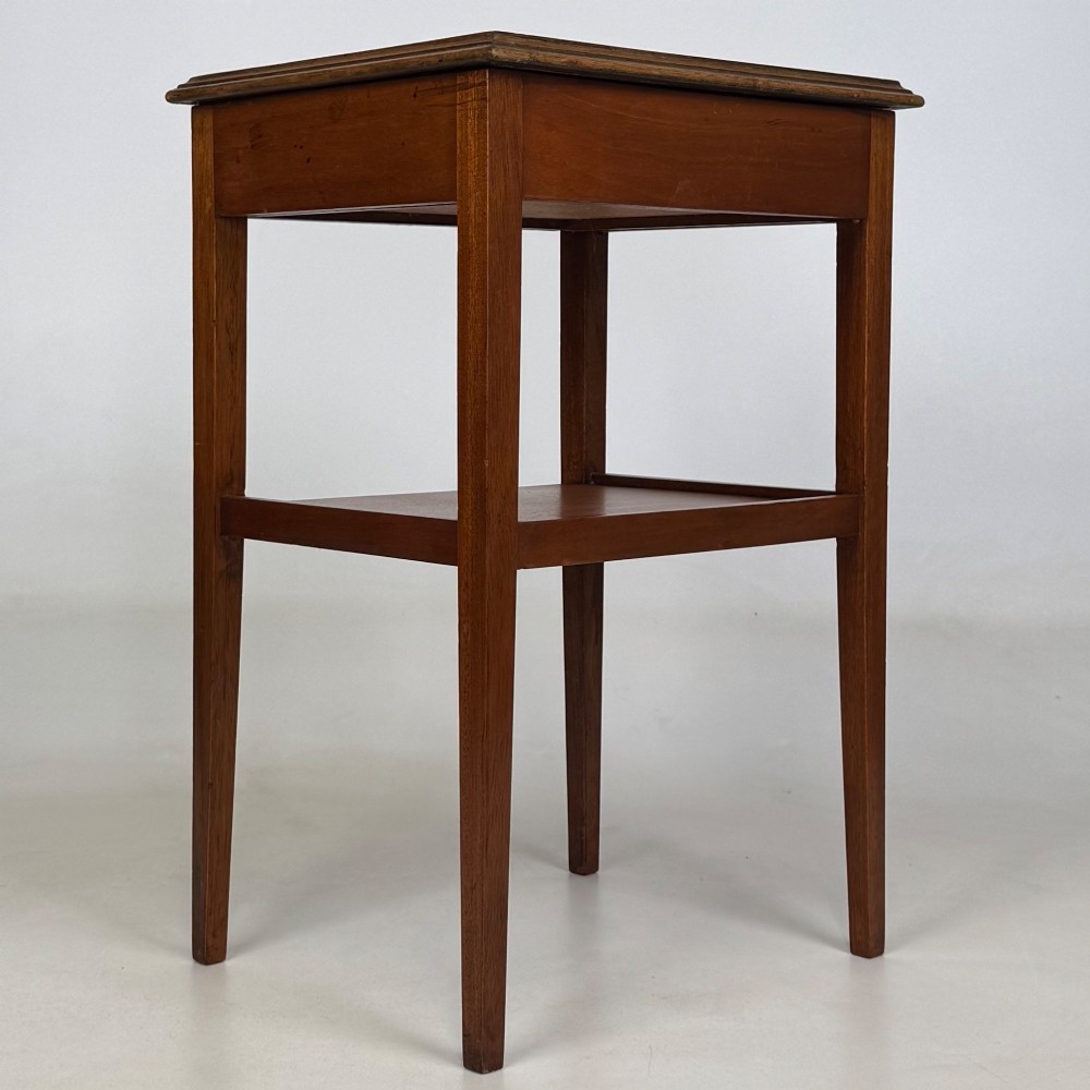 A pair of tall, slim mahogany bedside tables with single top drawers, round brass ring handles, open lower shelves, and tapered legs. View V