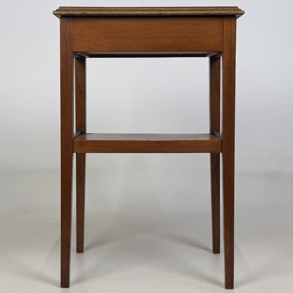 A pair of tall, slim mahogany bedside tables with single top drawers, round brass ring handles, open lower shelves, and tapered legs. View VI