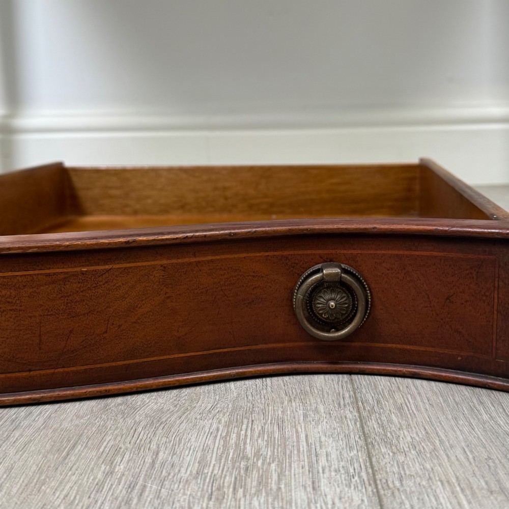 A mahogany writing table featuring a raised superstructure with small drawers and side cupboards above two main frieze drawers, supported by square tapered fluted legs. View XI