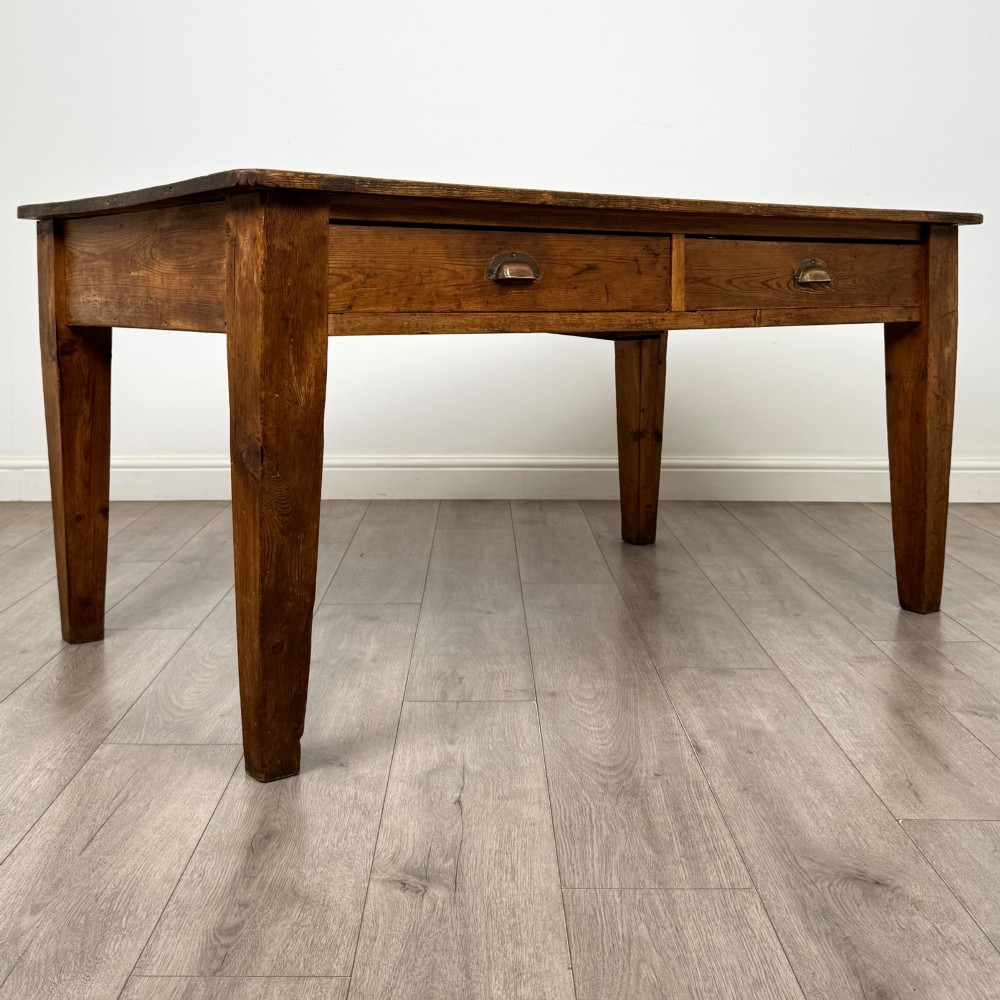 A 19th-century pine writing table featuring two front drawers with brass cup handles and tapered square legs. View VIII