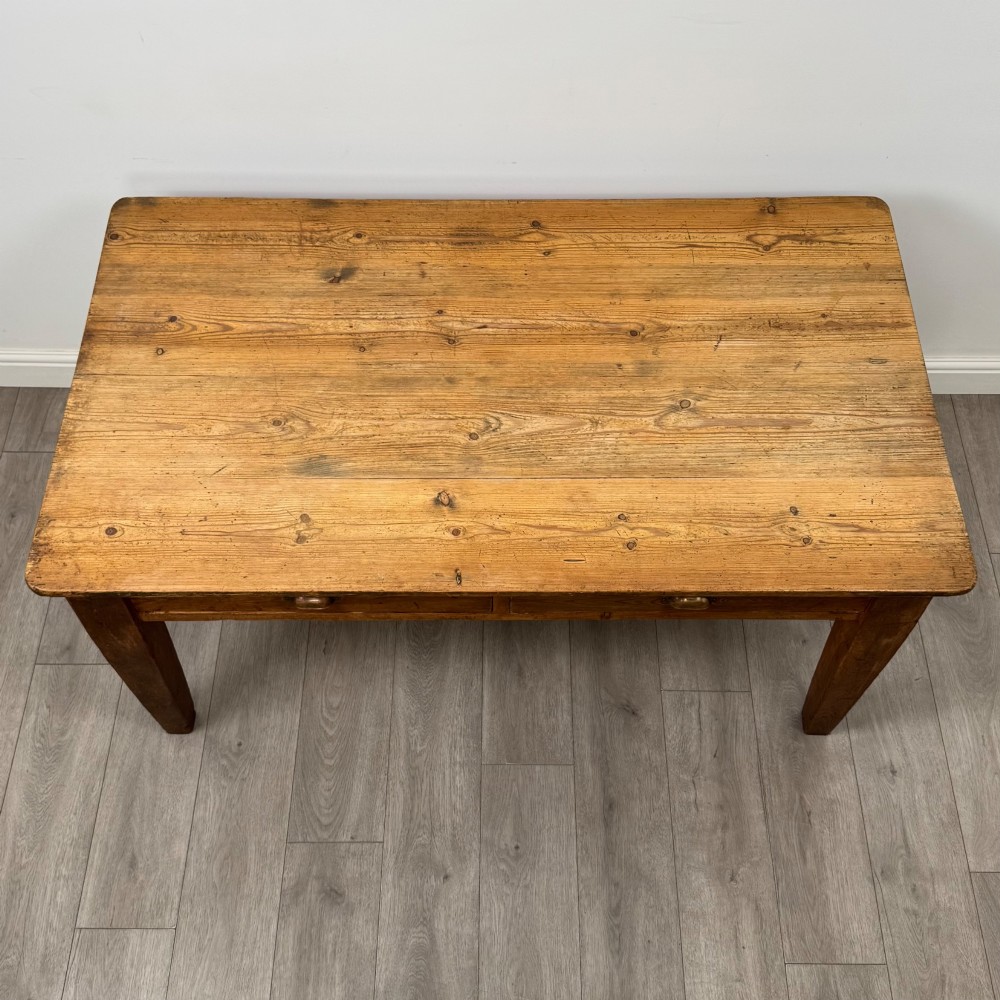 A 19th-century pine writing table featuring two front drawers with brass cup handles and tapered square legs. View IX