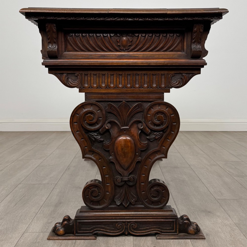 A 19th-century French-style carved walnut side table featuring two decorated drawers, scrolling legs, and paw feet. View III
