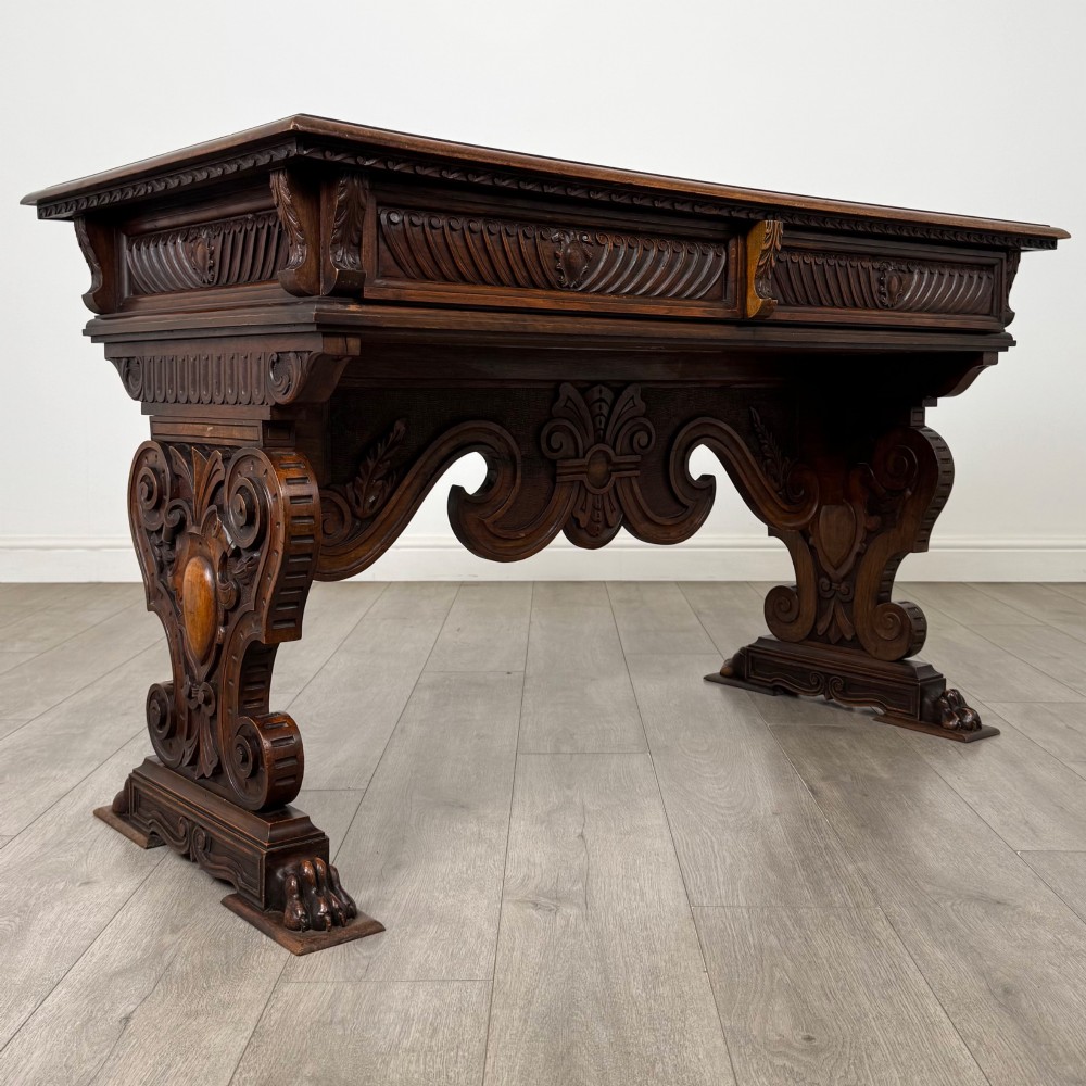 A 19th-century French-style carved walnut side table featuring two decorated drawers, scrolling legs, and paw feet. View VIII