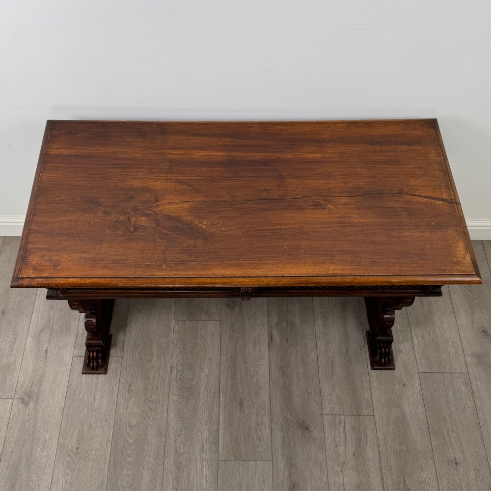 A 19th-century French-style carved walnut side table featuring two decorated drawers, scrolling legs, and paw feet. View IX