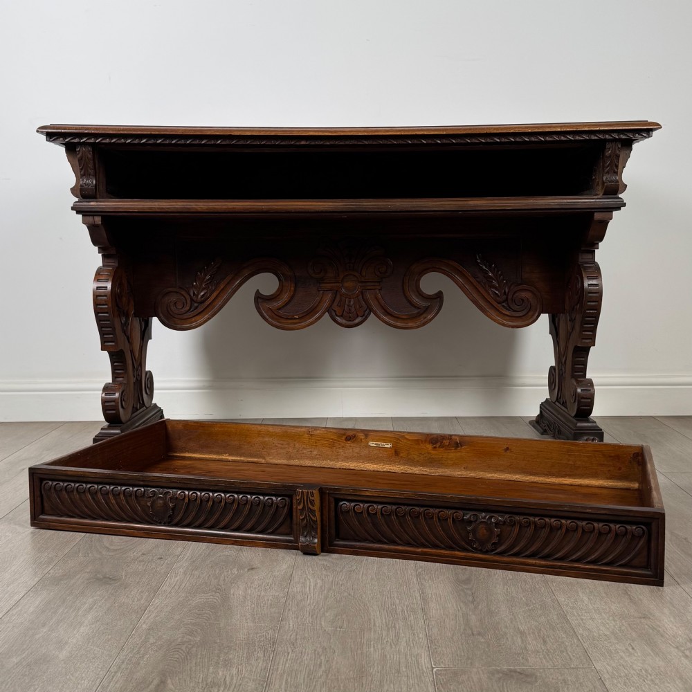 A 19th-century French-style carved walnut side table featuring two decorated drawers, scrolling legs, and paw feet. View X