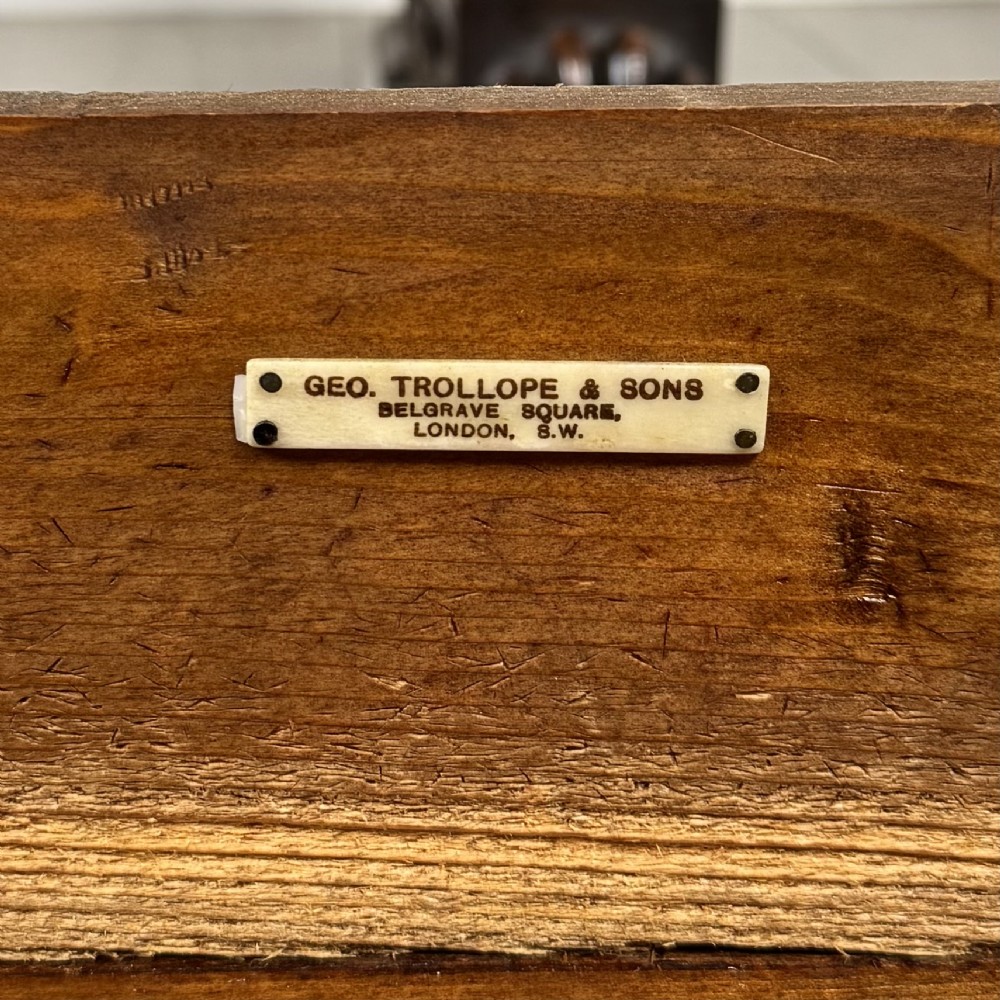 A 19th-century French-style carved walnut side table featuring two decorated drawers, scrolling legs, and paw feet. View XI