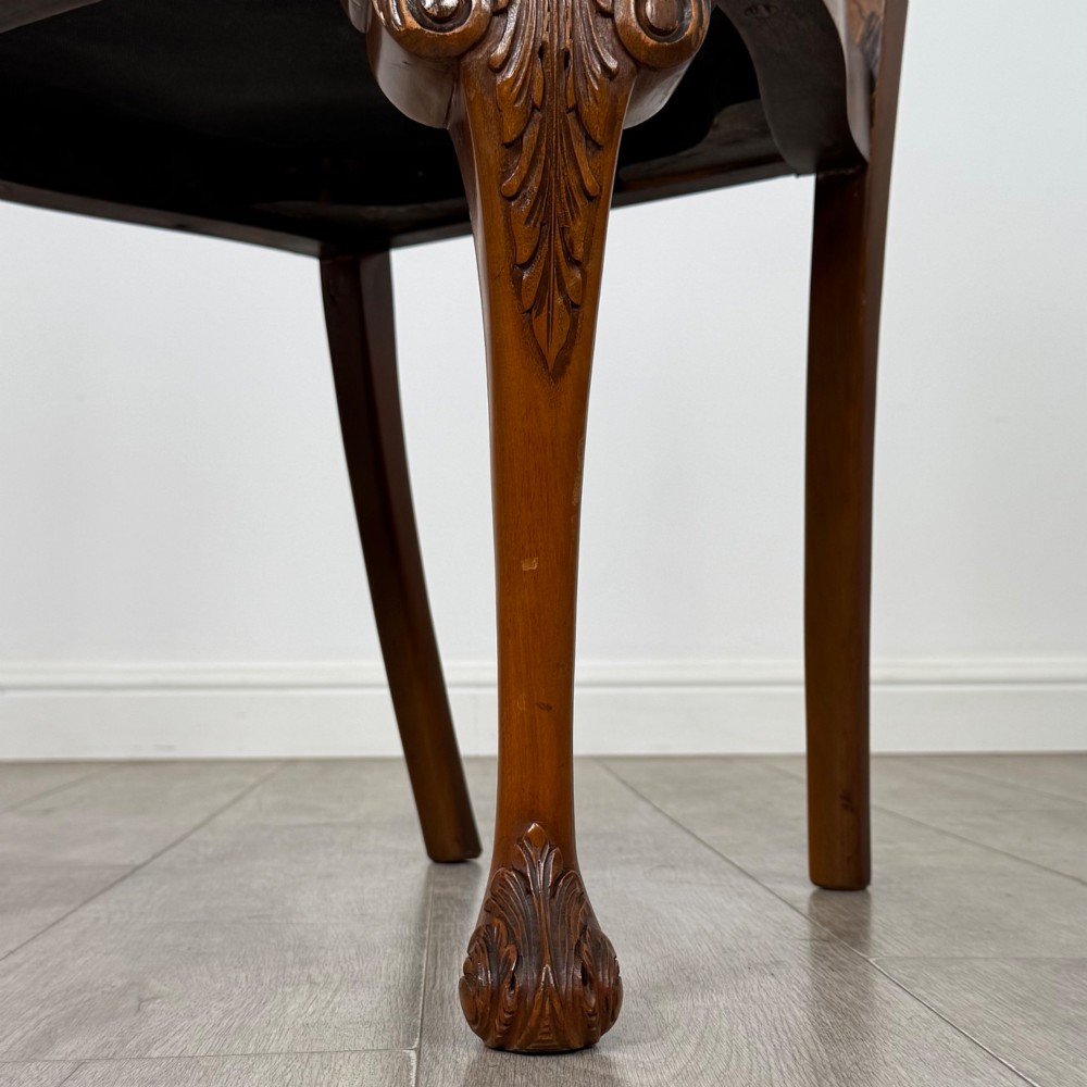 A set of eight Queen Anne revival burr walnut dining chairs featuring carved cabriole legs, claw and ball feet, vasiform splat backs, and patterned upholstered seats. View VII