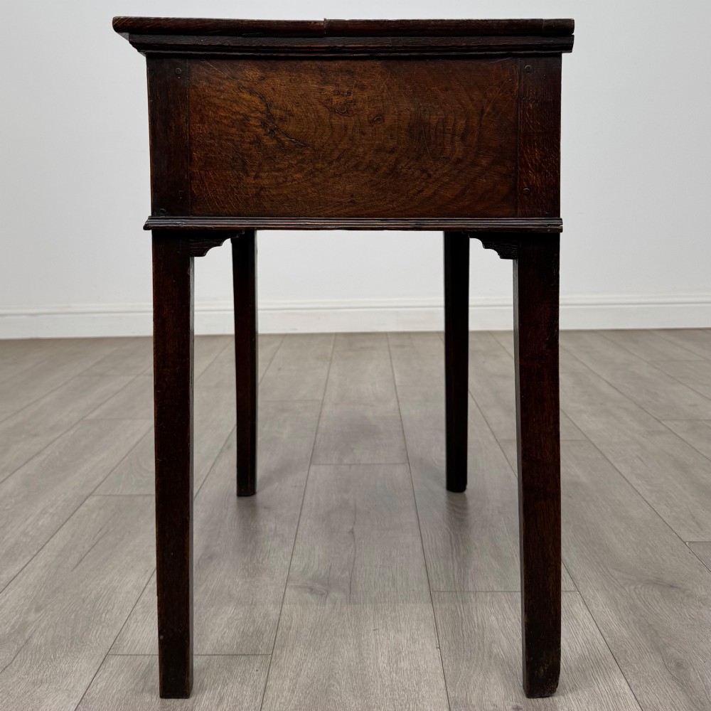 An 18th-century Georgian oak side table featuring a single frieze drawer with brass handles and straight square legs. View III