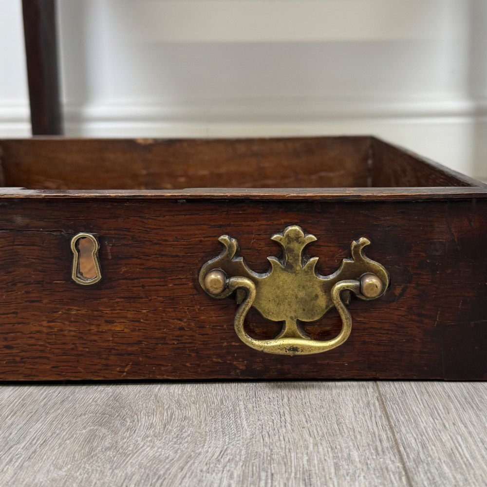 An 18th-century Georgian oak side table featuring a single frieze drawer with brass handles and straight square legs. View XI