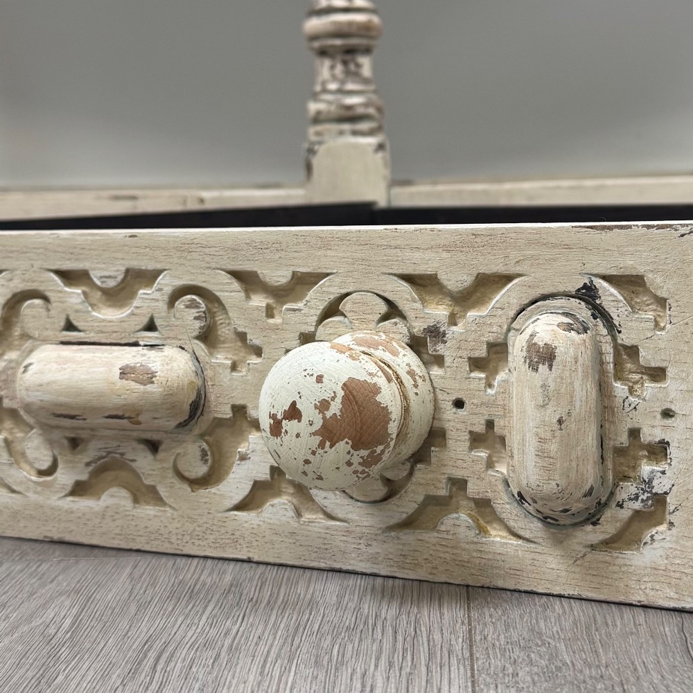 A 20th-century country house style console table featuring a distressed cream-painted carved base with five turned legs and a polished dark oak top. View XI