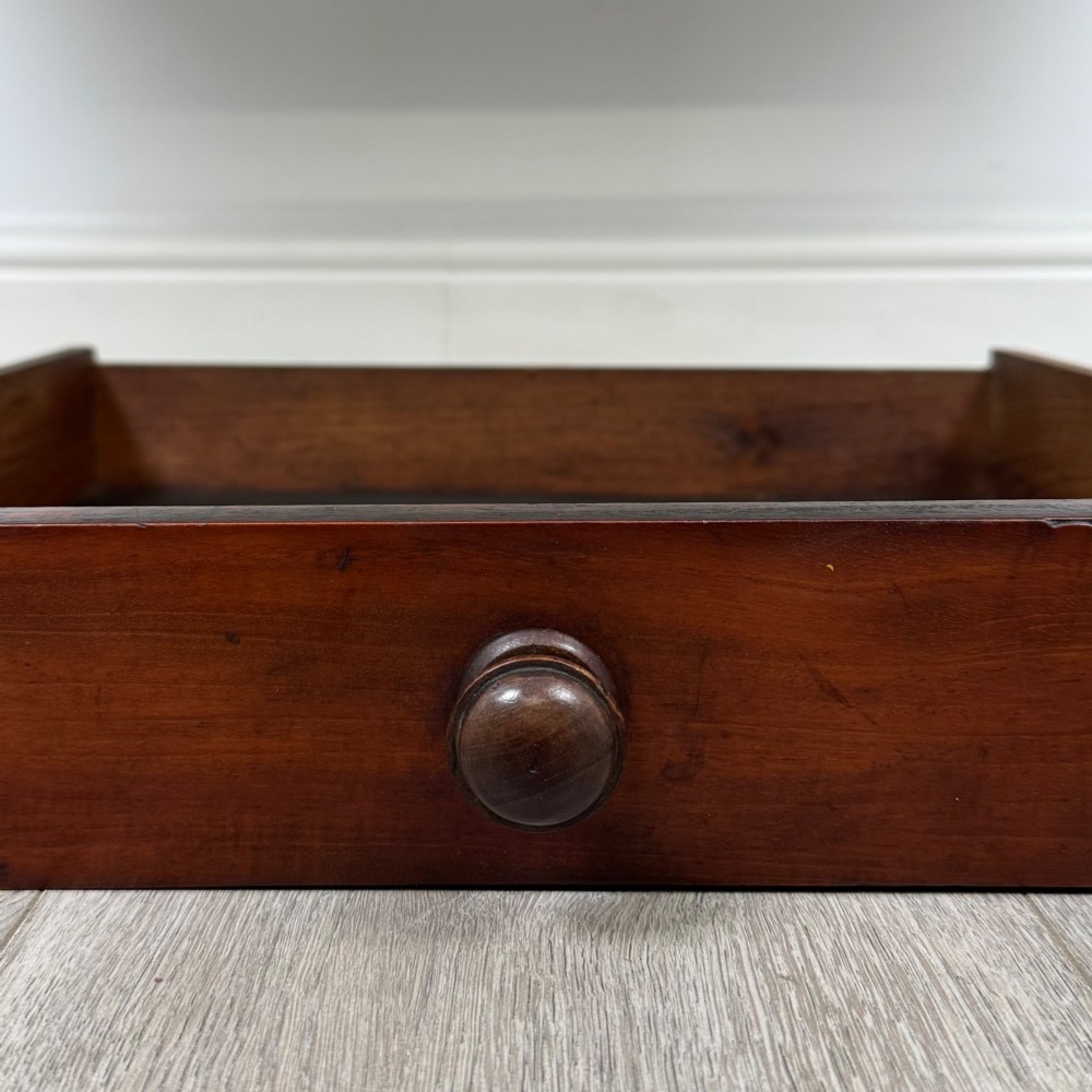 A 19th-century mahogany writing table featuring turned legs and a single frieze drawer with a wooden knob handle. View XI